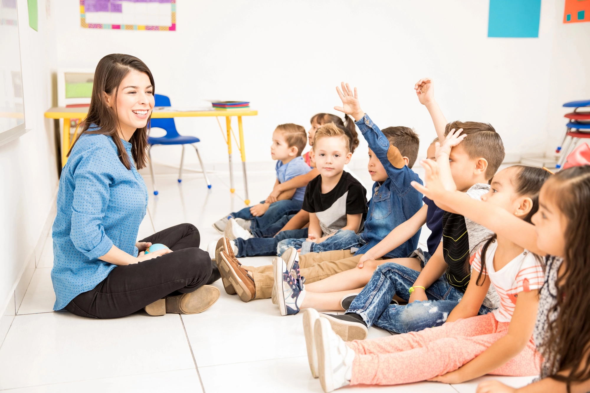 Teacher guiding a calm classroom discussion at Bigger Blessings Preschool